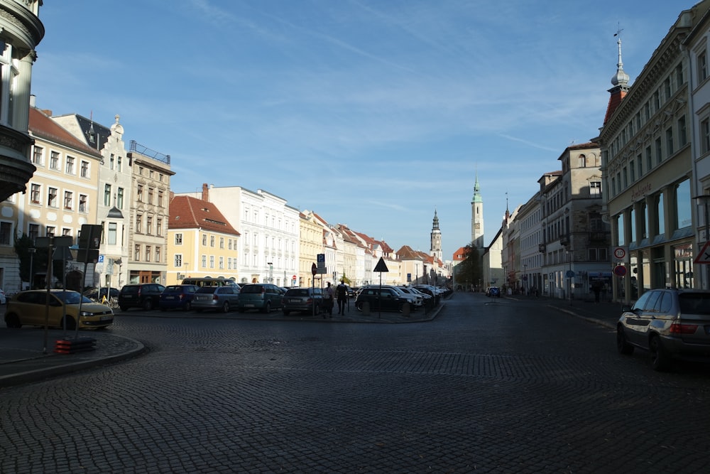 a city street with cars parked on the side of it