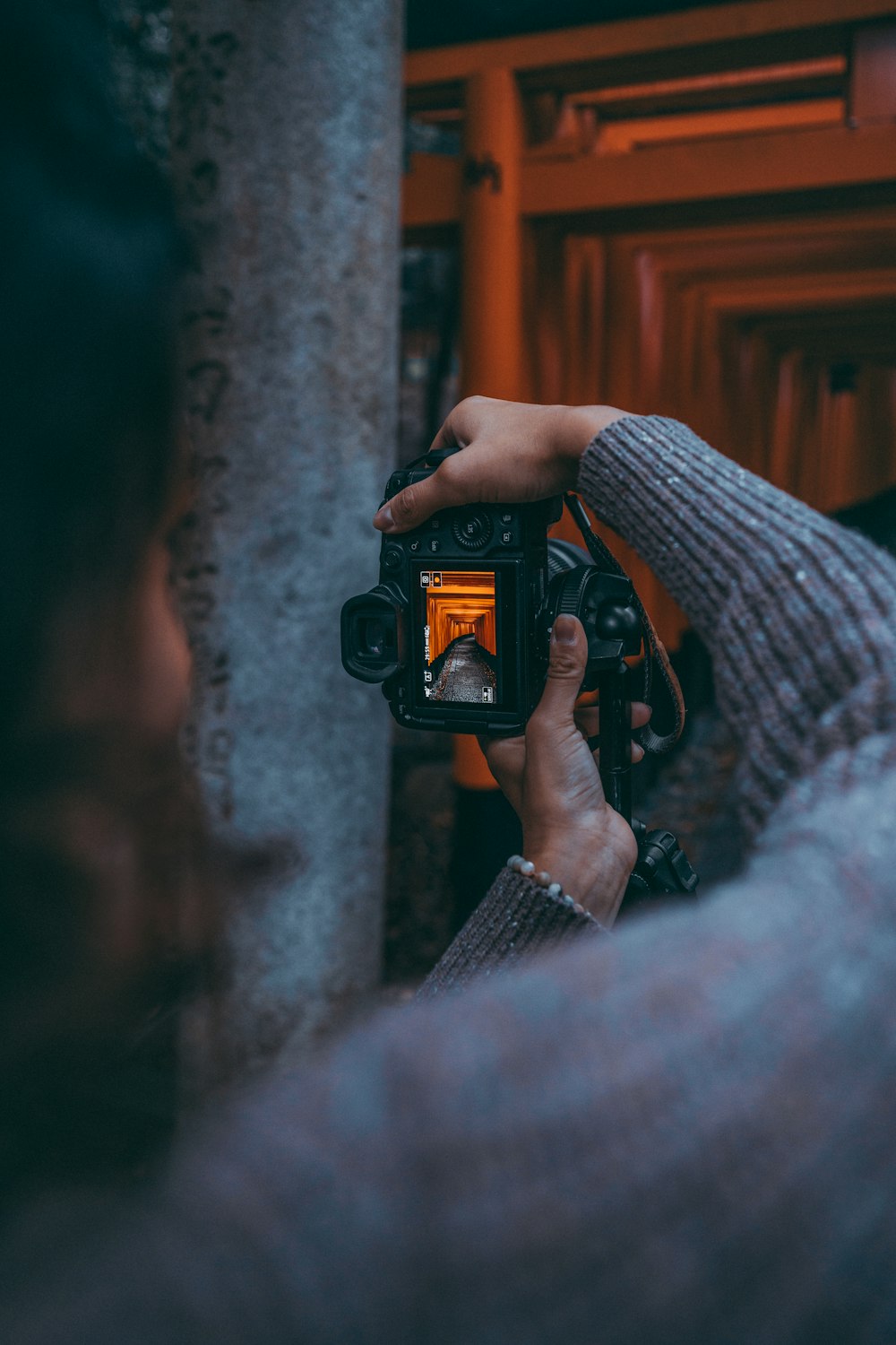 a person holding a camera up to take a picture