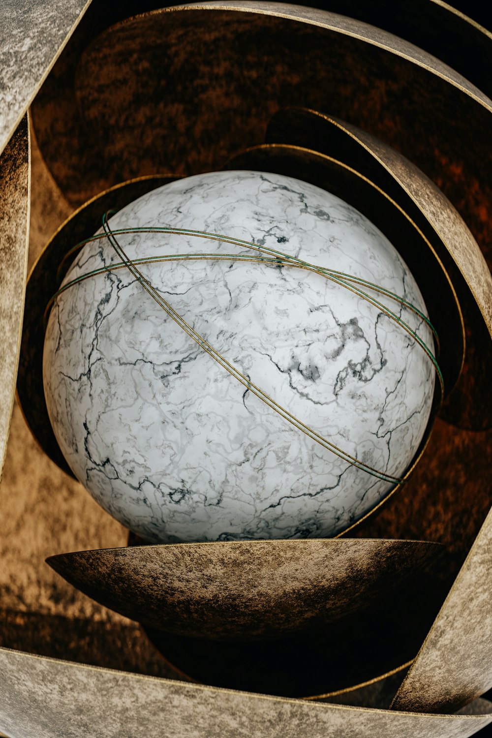 a marble ball sitting inside of a metal container