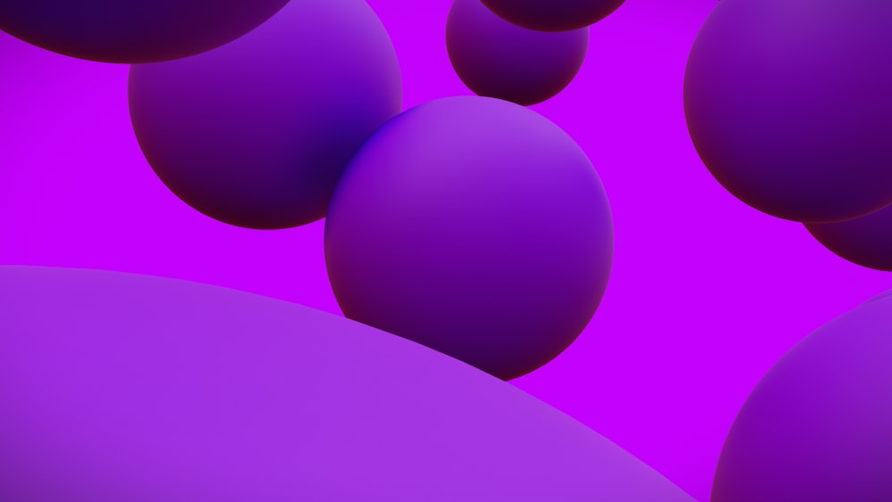 a bunch of purple balls floating in the air