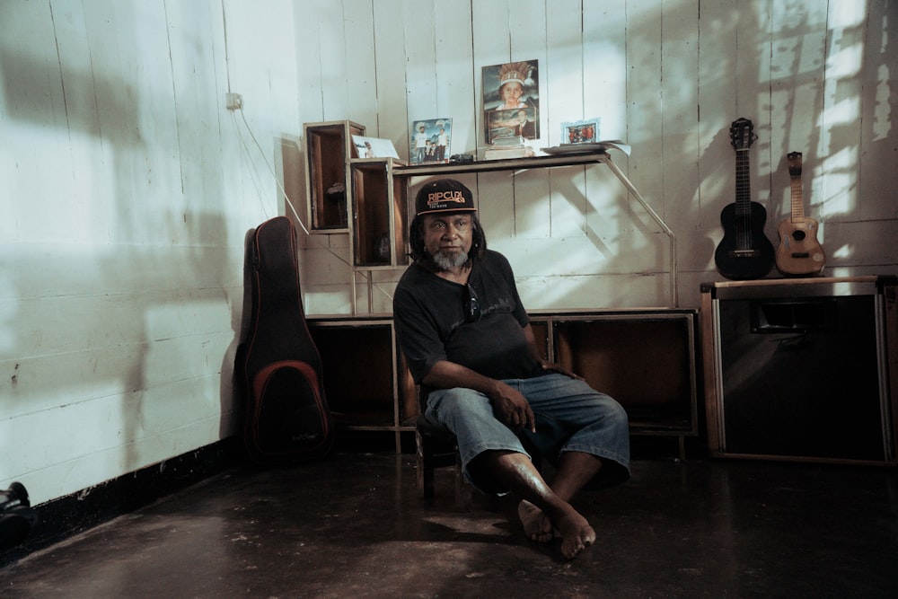 a man sitting in a chair in a room