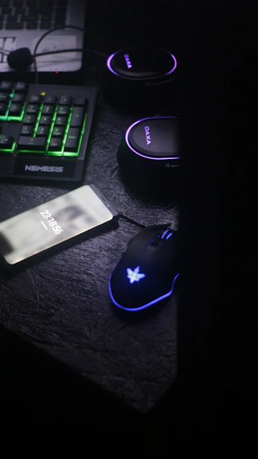 A sleek, dark-themed workspace with a focused gamer streaming professionally, illuminated by soft blue lighting.