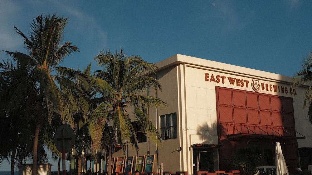 a building with palm trees in front of it