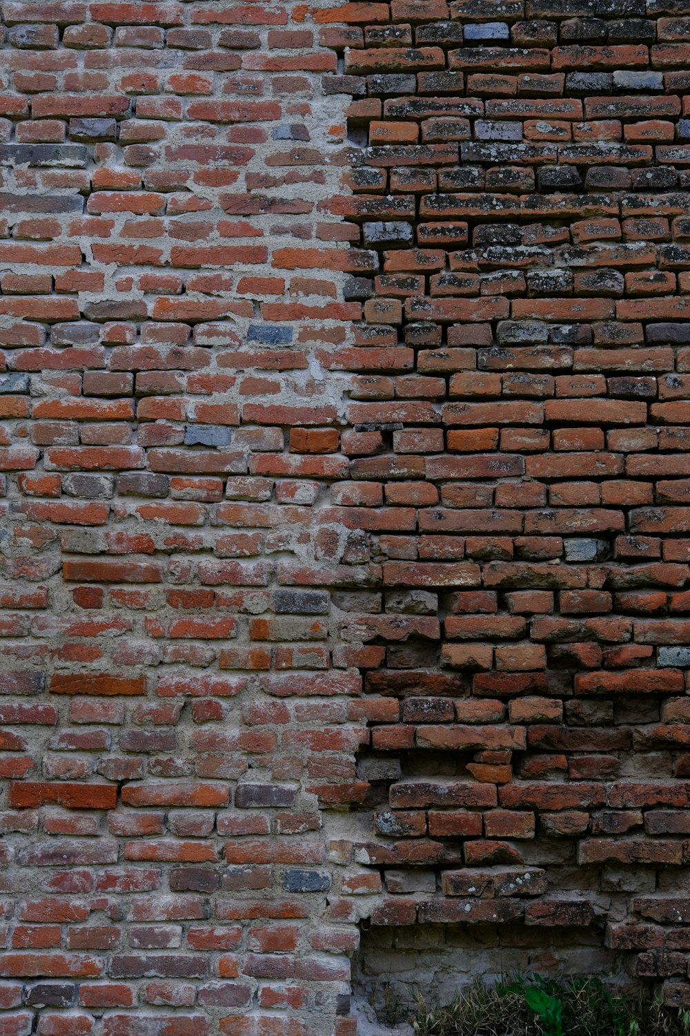 a brick wall with a clock on the side of it