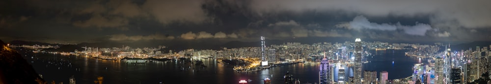 a view of a city at night from the top of a hill