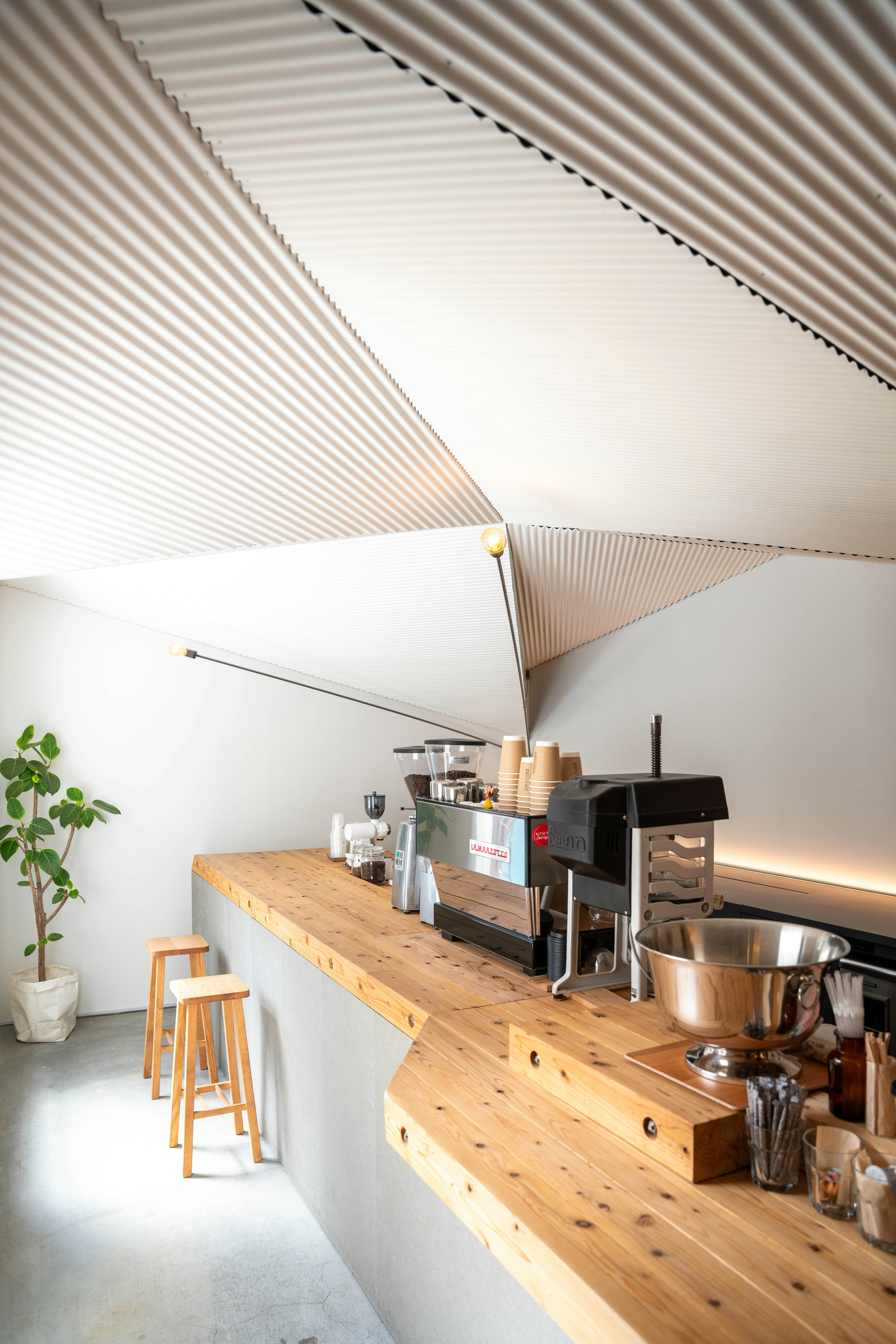 a kitchen with a counter and stools next to it