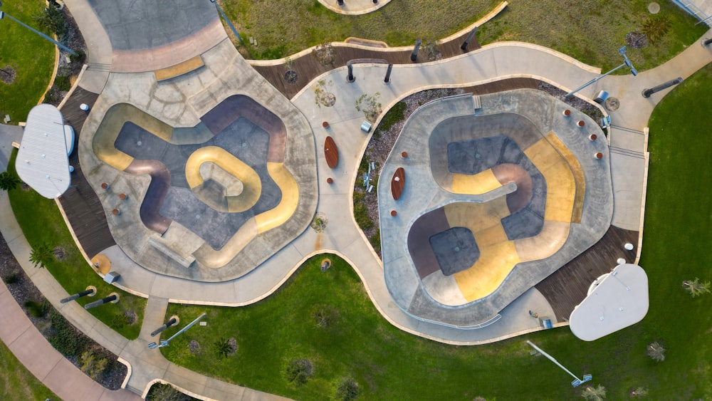 an aerial view of a skate park with ramps and ramps