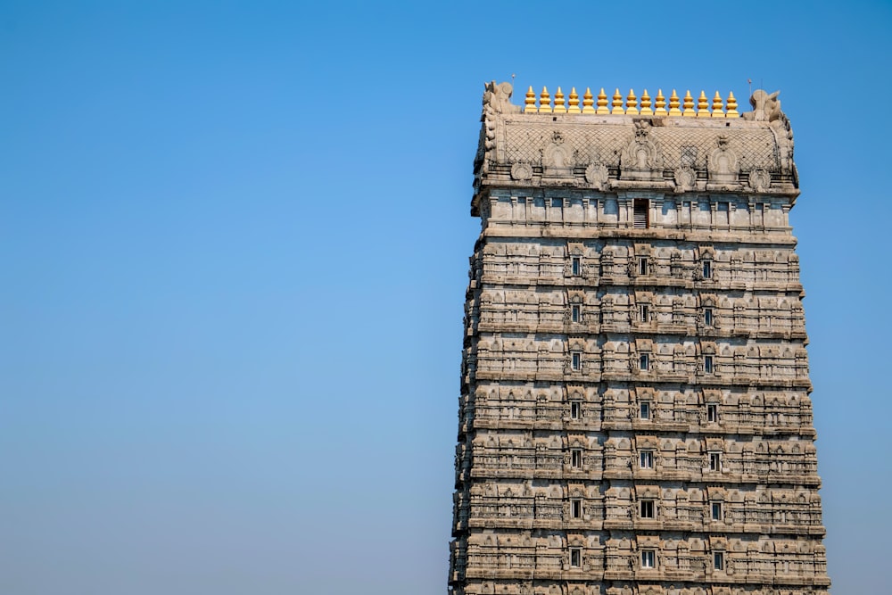 a tall tower with a clock on the top of it