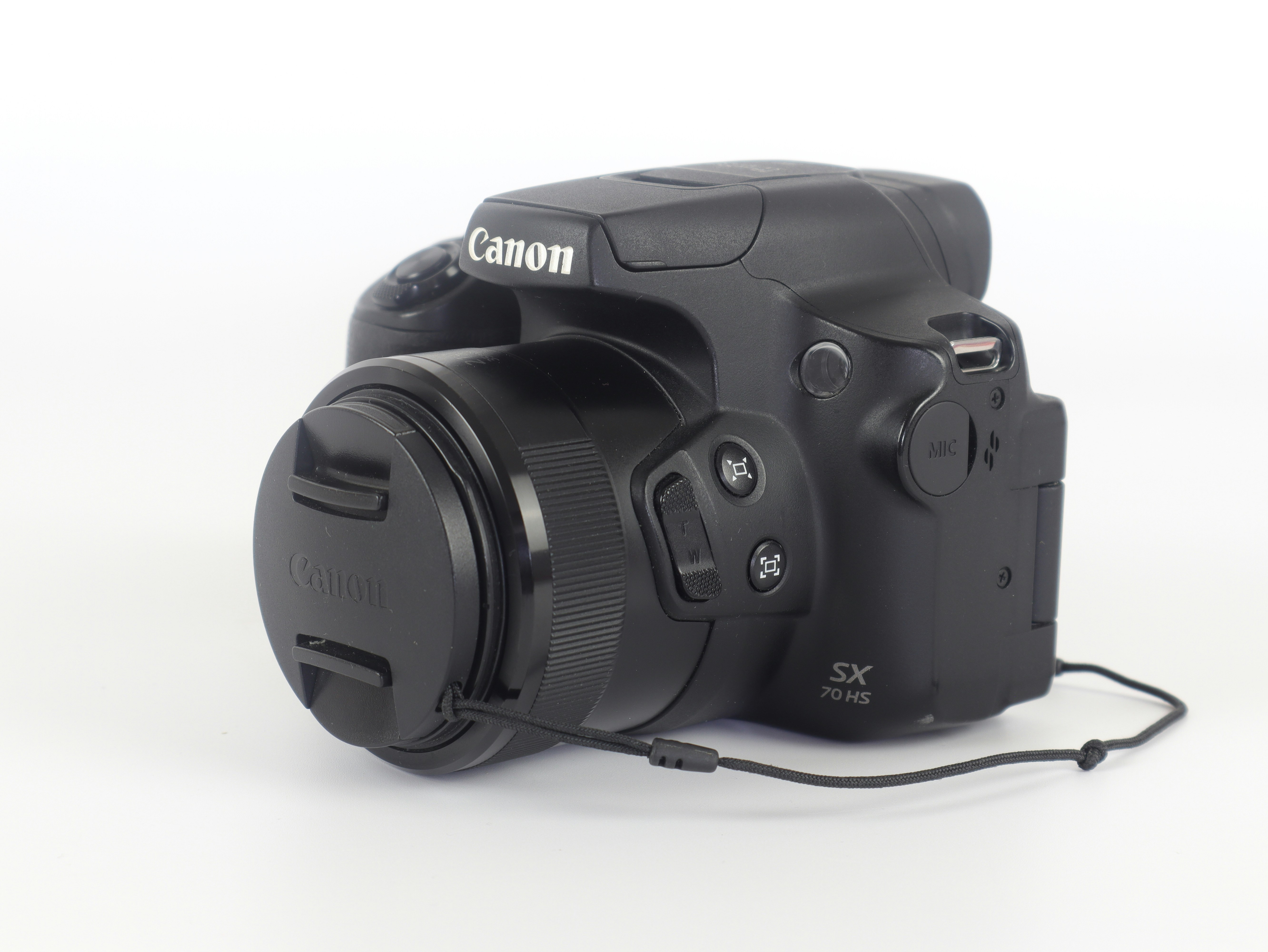 a black camera sitting on top of a white table