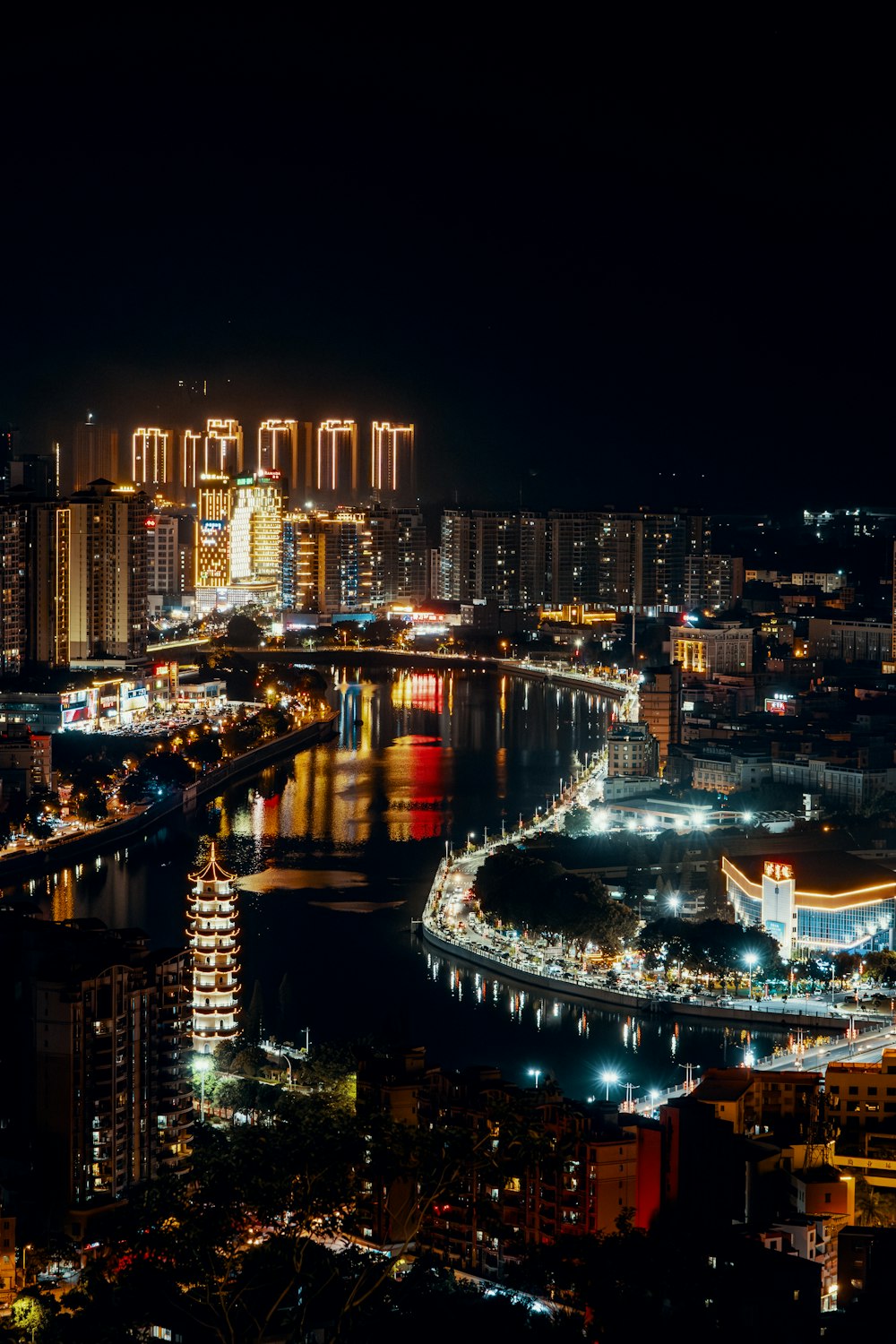 a night view of a city and a river