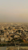 A detailed topographic map overlaying Casablanca's cityscape at sunset.