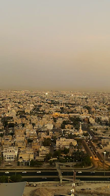 A detailed topographic map overlaying Casablanca's cityscape at sunset.