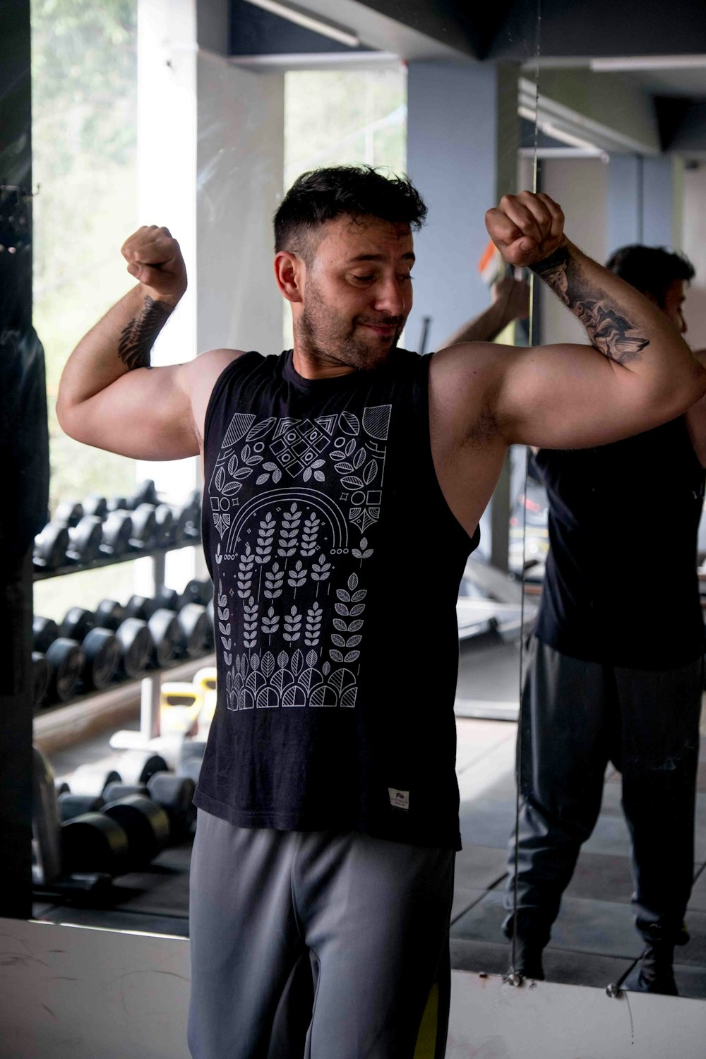 a man in a gym lifting a barbell