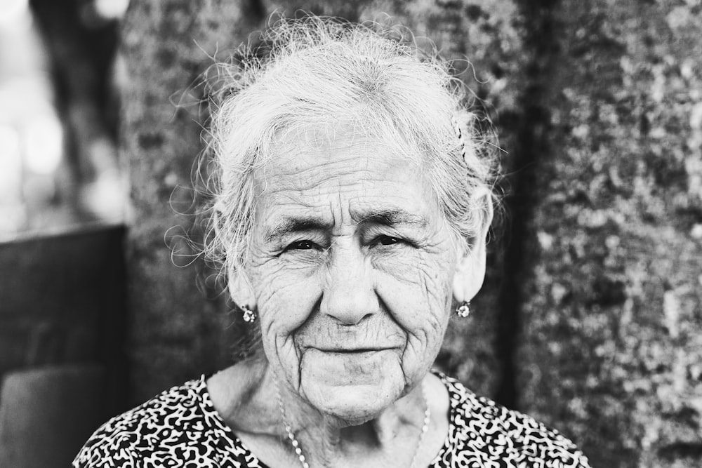 a black and white photo of an old woman