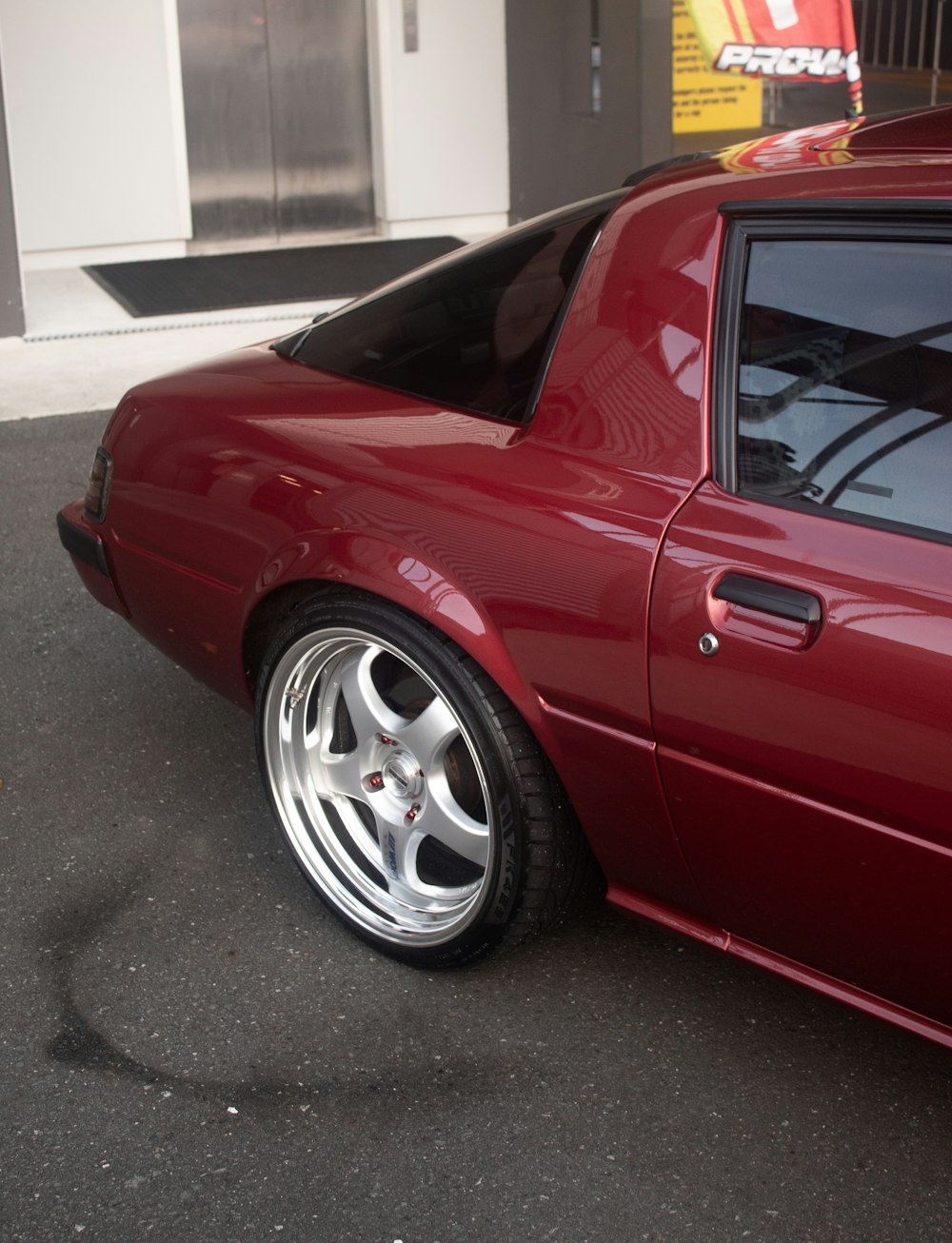 a red sports car parked in a parking lot