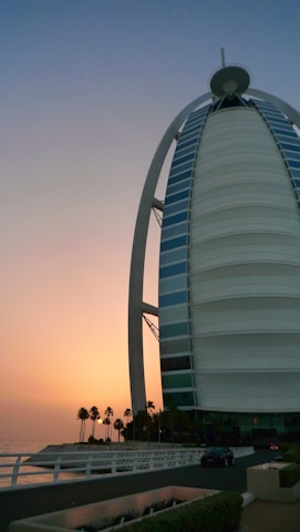 The sparkling Burj Al Arab seen from the water during a peaceful sunset cruise.