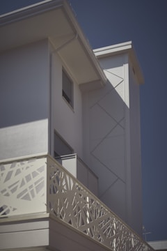 Modern residential building with clean lines and minimalist facade under natural daylight.