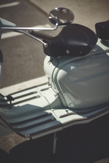 A close-up of a stylish scooter parked in a picturesque location.
