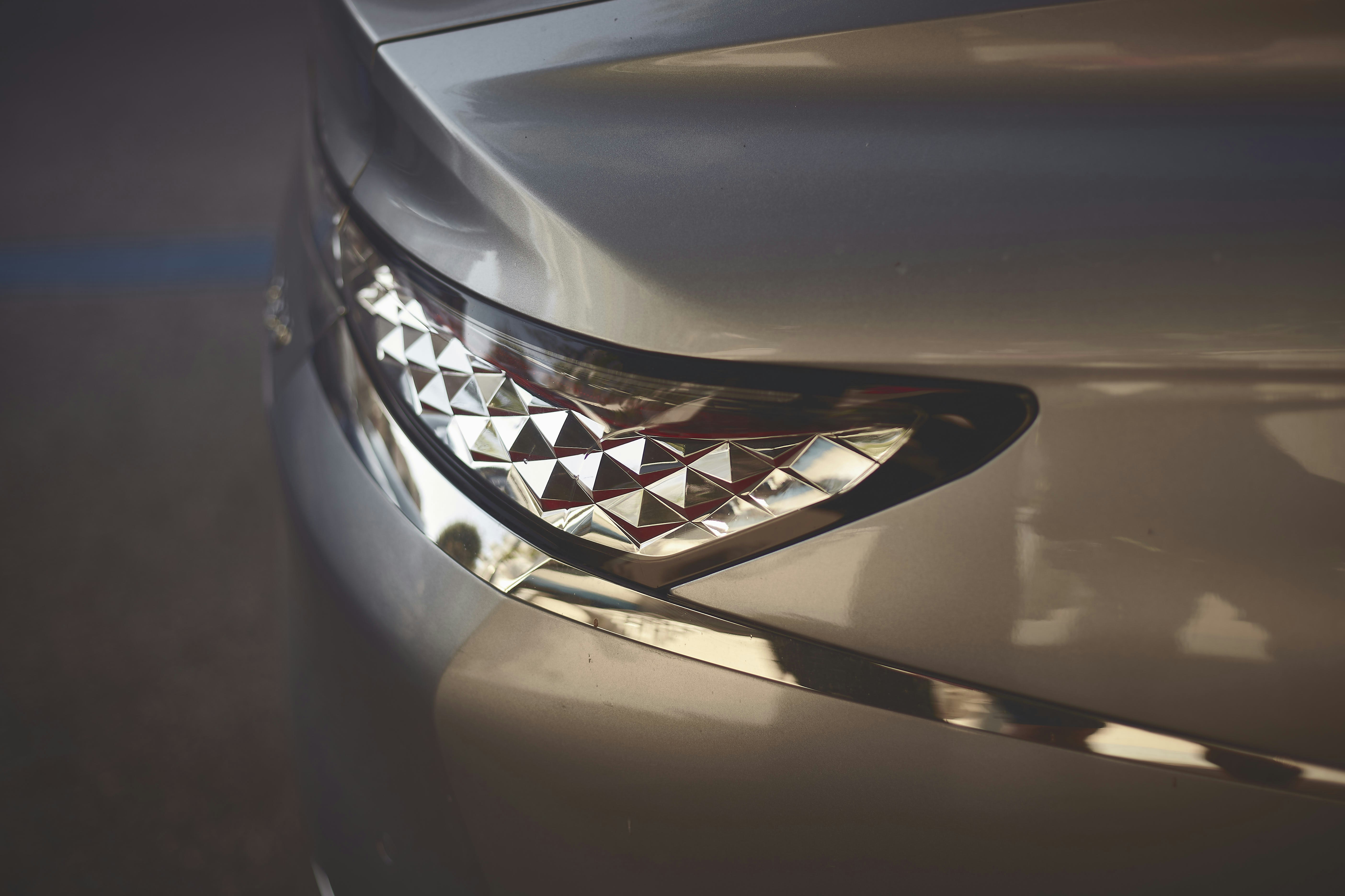 a close up of a car's headlight with a shark's teeth