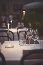 An elegant dining setup under the stars with soft ambient lighting.