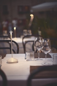 An elegant dining setup under the stars with soft ambient lighting.