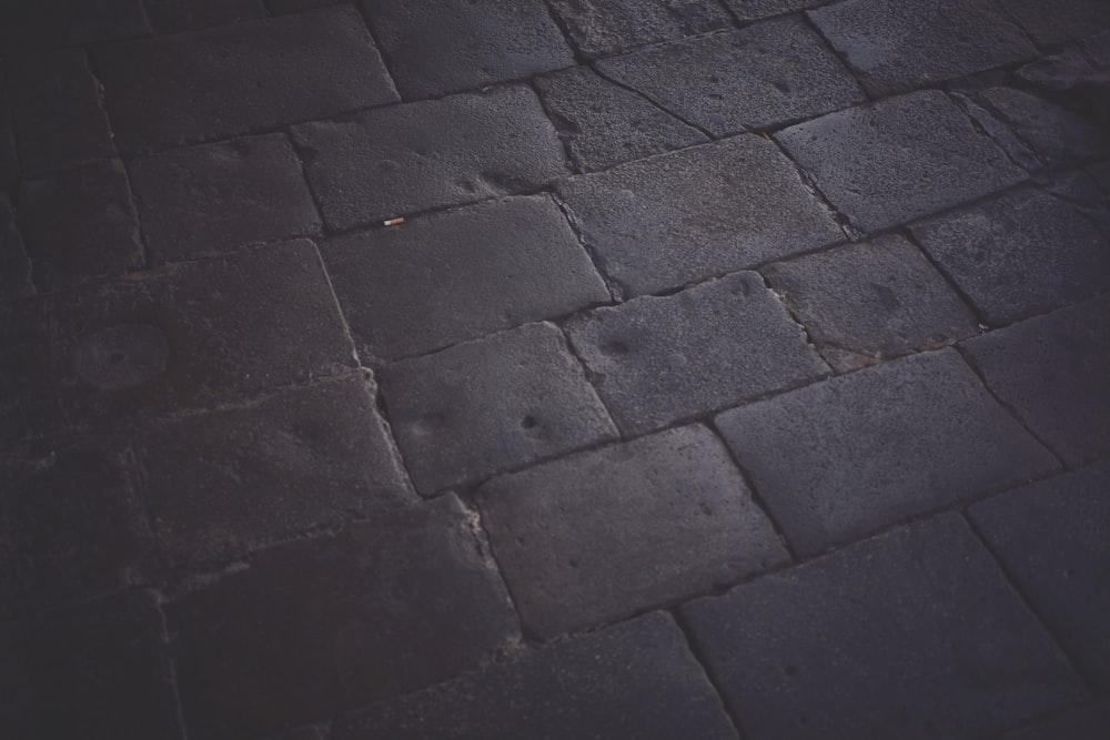 a close up of a black stone floor