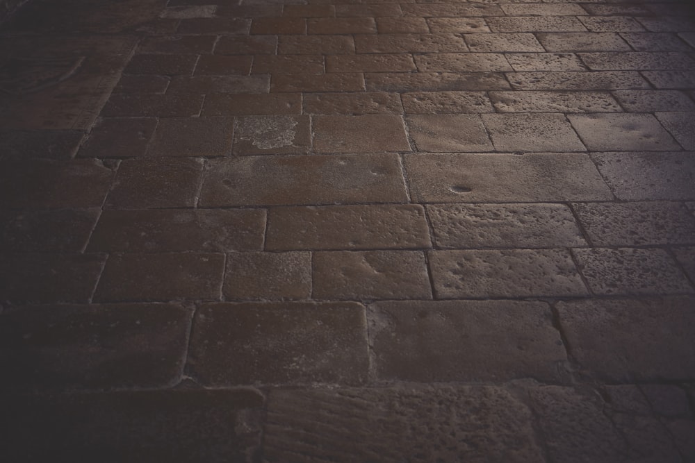 a brick floor with a light shining on it