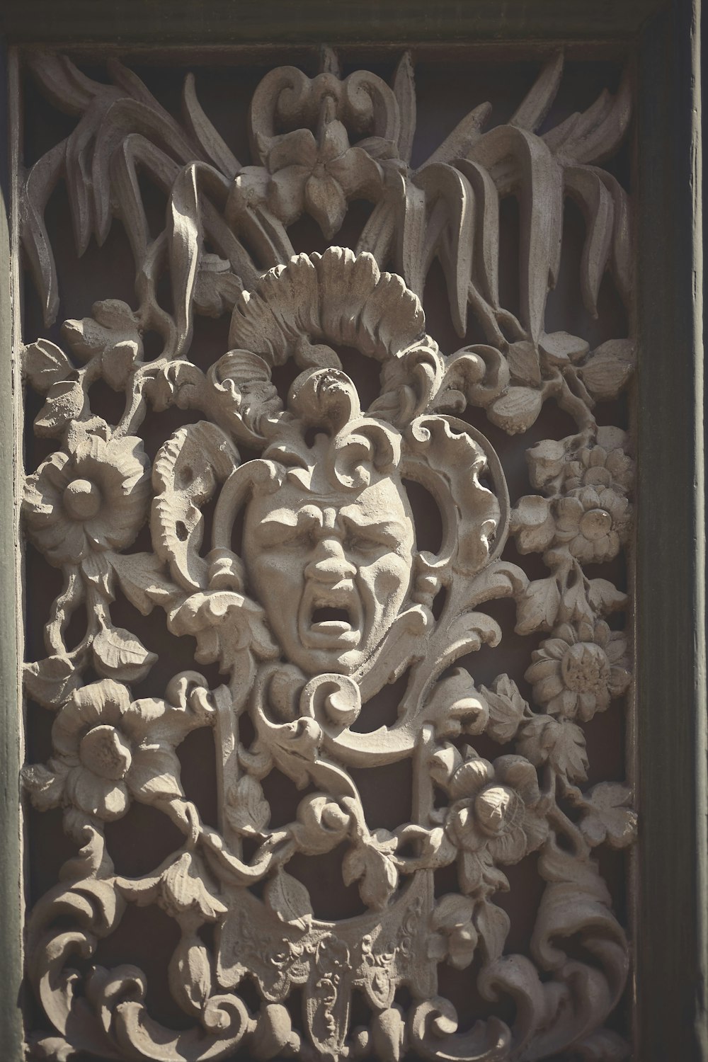 a carving on the side of a building