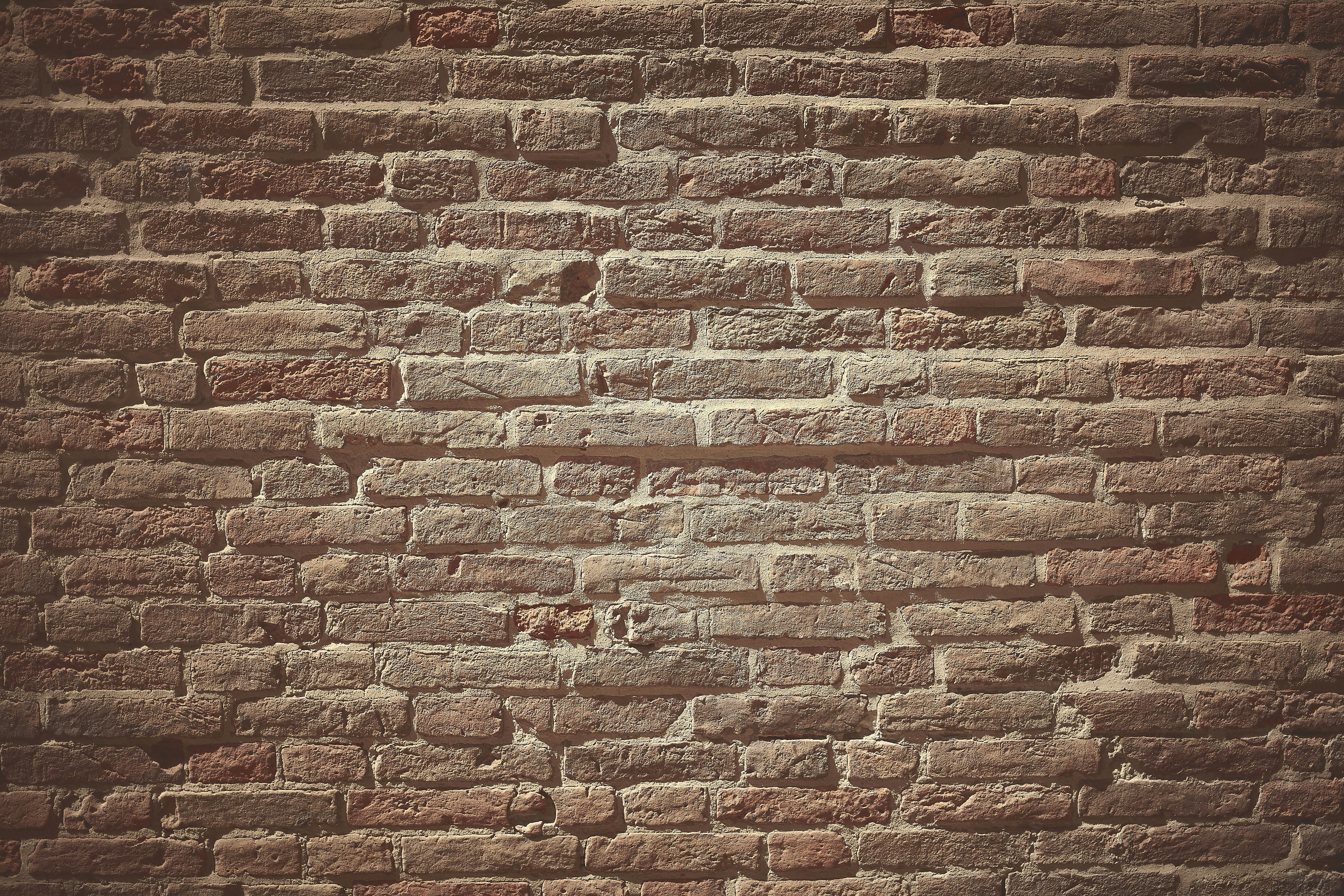 a brick wall with a small crack in it