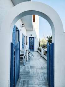 a blue and white building with a blue door