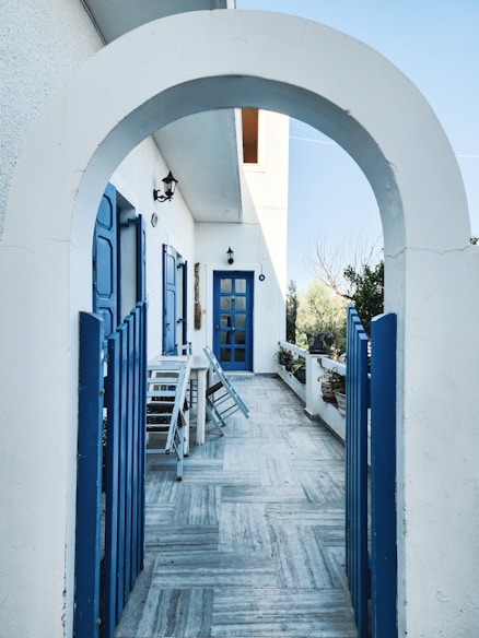 a blue and white building with a blue door