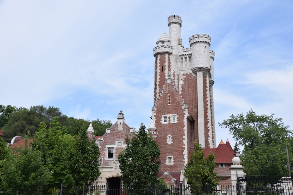 a tall brick building with a clock on it's side