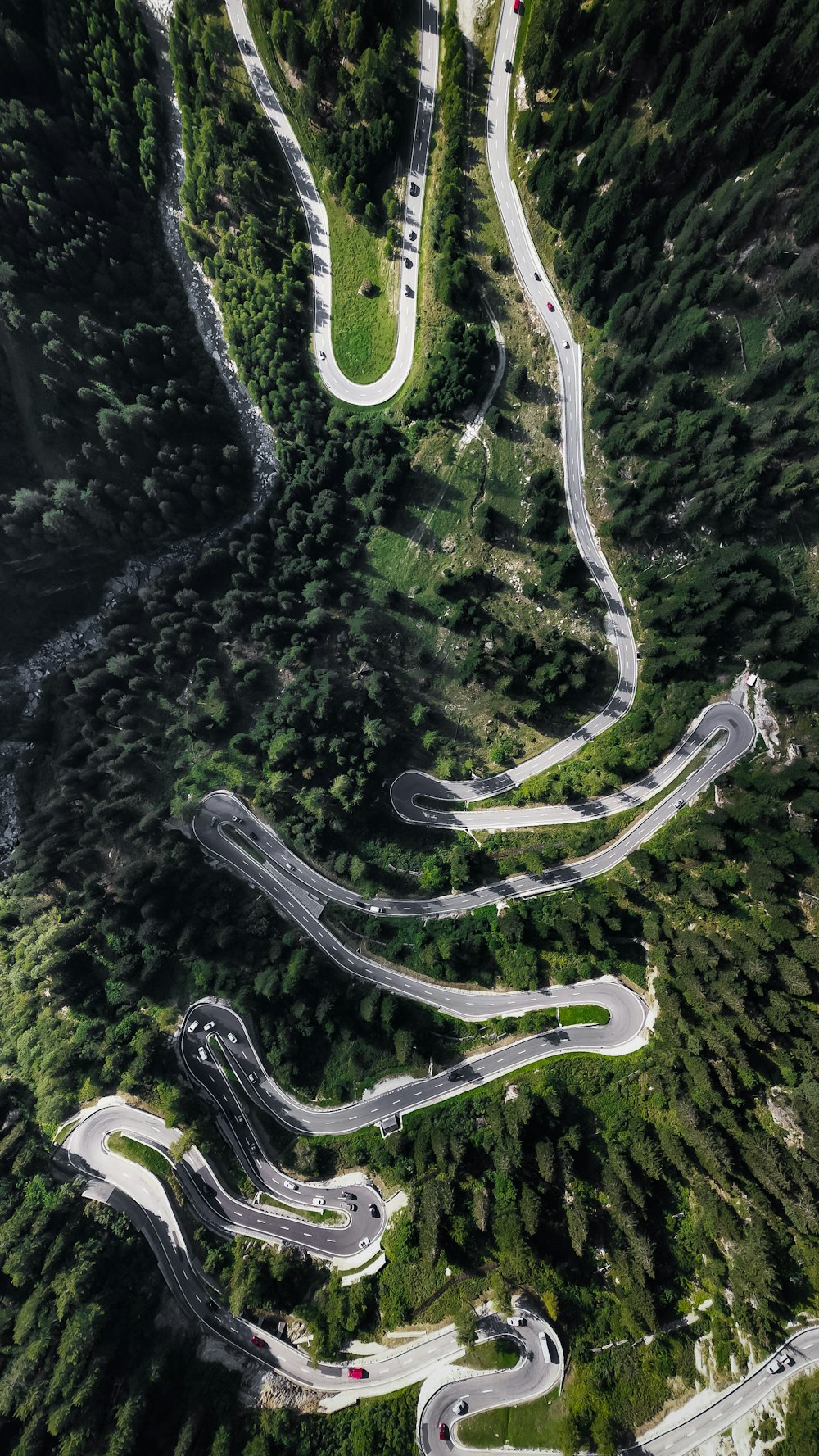 an aerial view of a winding mountain road