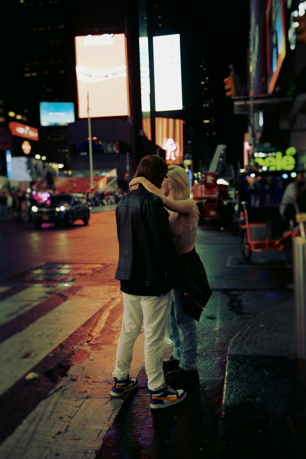 a couple of people that are standing on a street