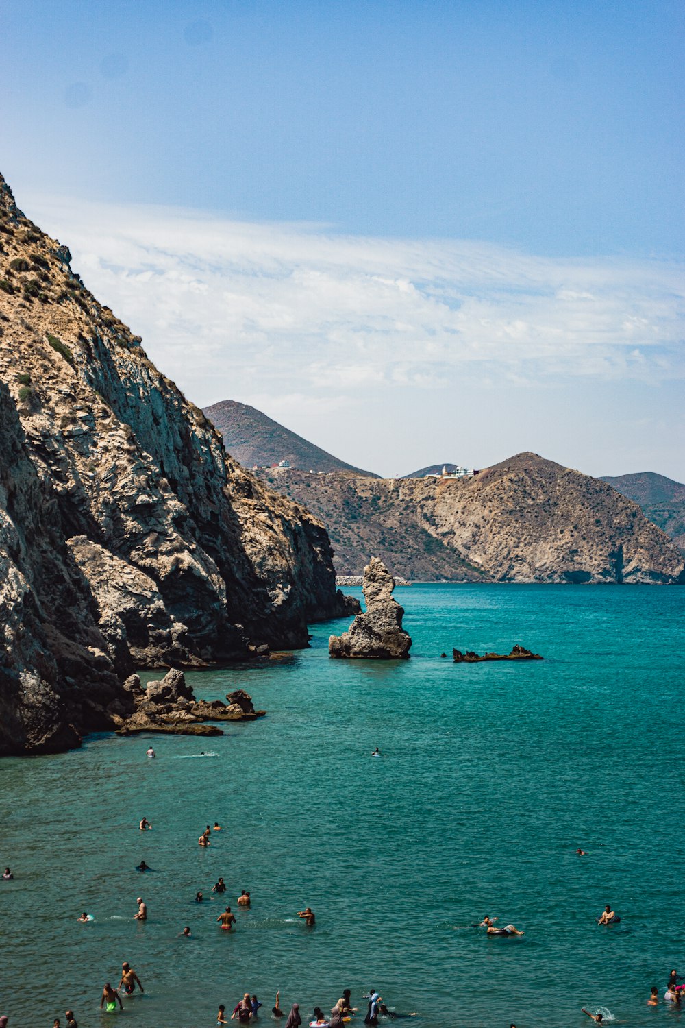 a group of people swimming in a body of water