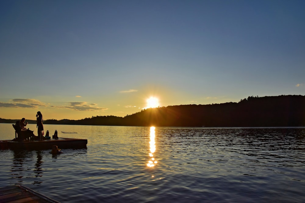 a couple of people that are on a boat in the water