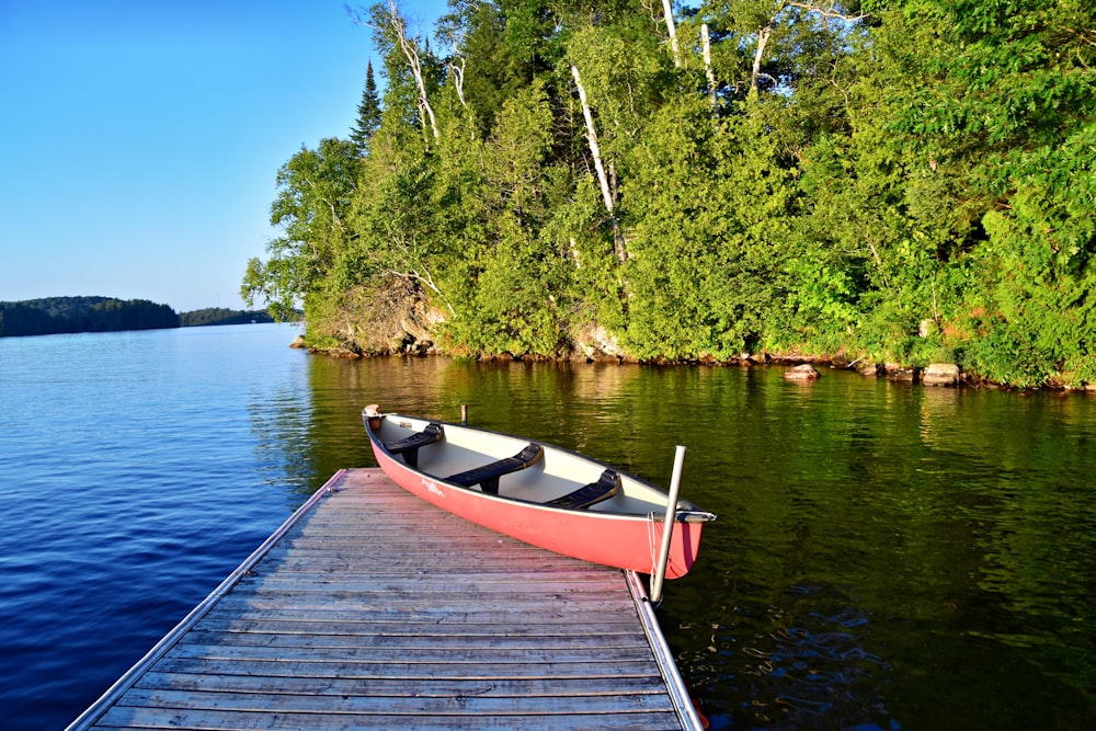 a boat is docked at the end of a dock