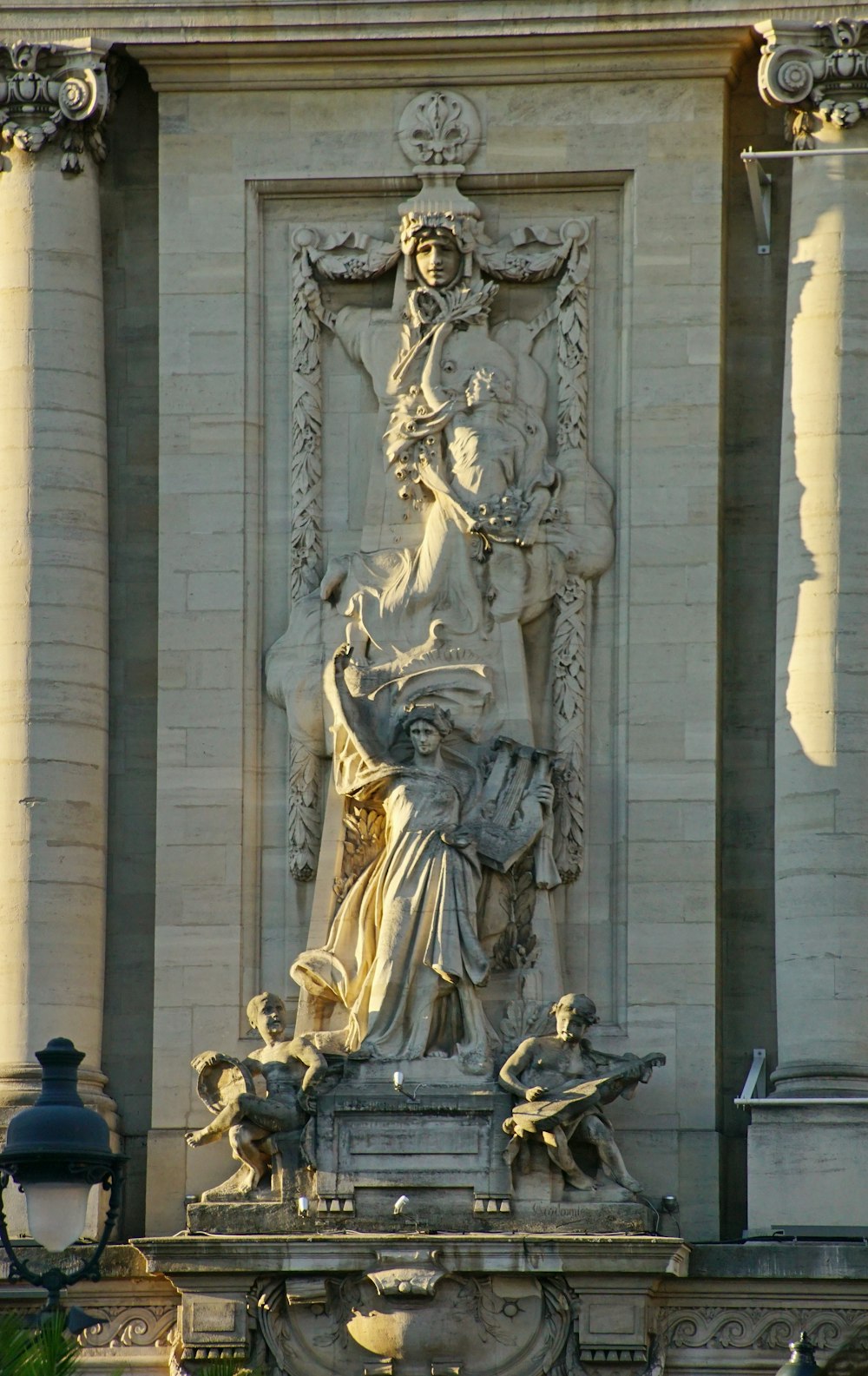 a statue on the side of a building