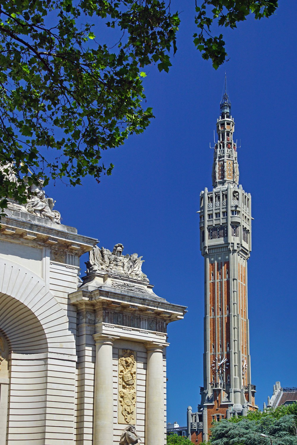 a tall clock tower towering over a city