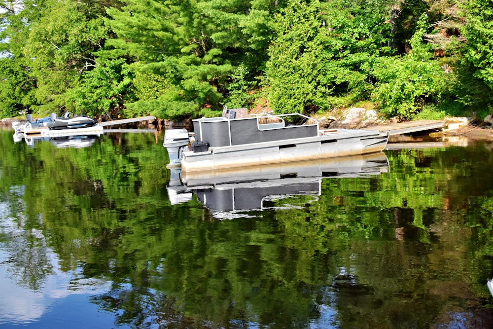 a group of boats floating on top of a lake