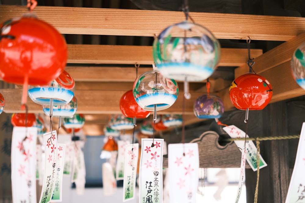 a bunch of glass ornaments hanging from a ceiling