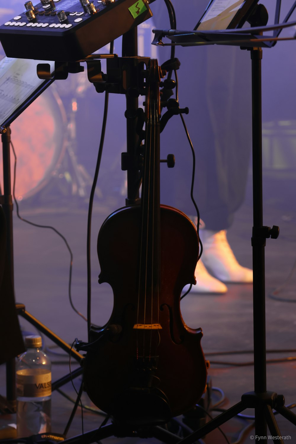 a violin and other musical equipment on a stage