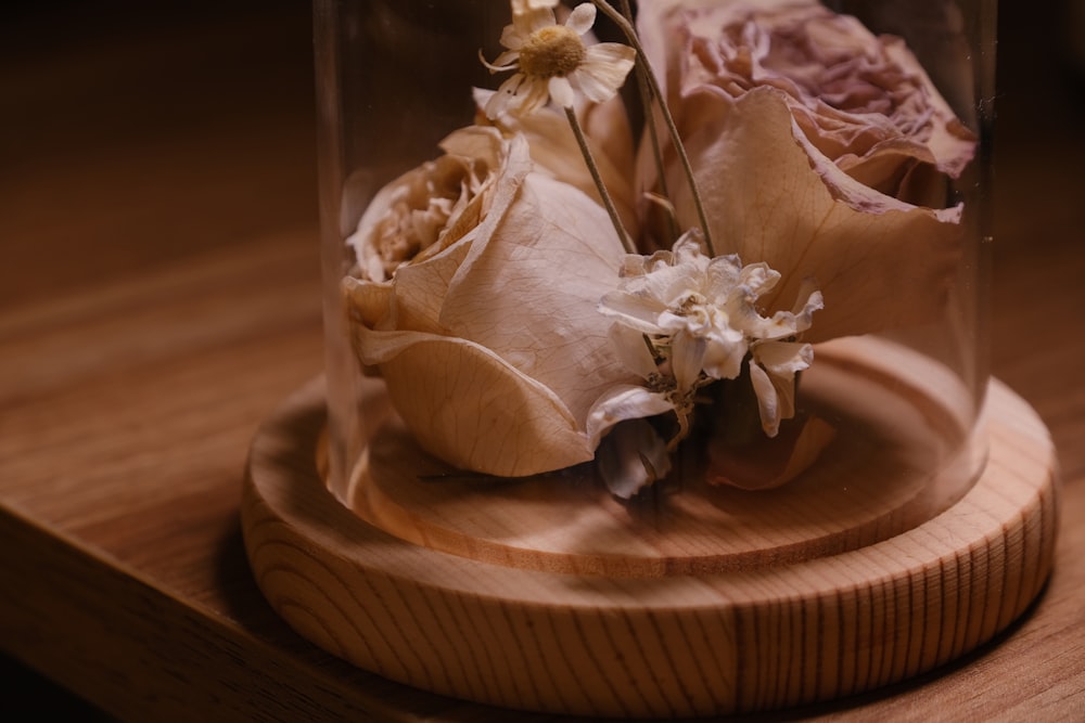 a vase with flowers inside of it on a table