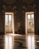 Sunlit Virtuosa gallery room with large windows and elegant seating.