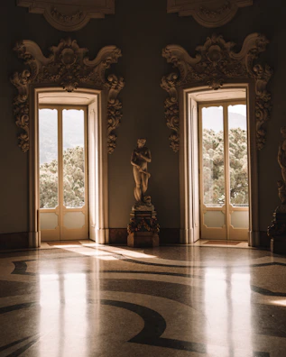 Sunlit Virtuosa gallery room with large windows and elegant seating.