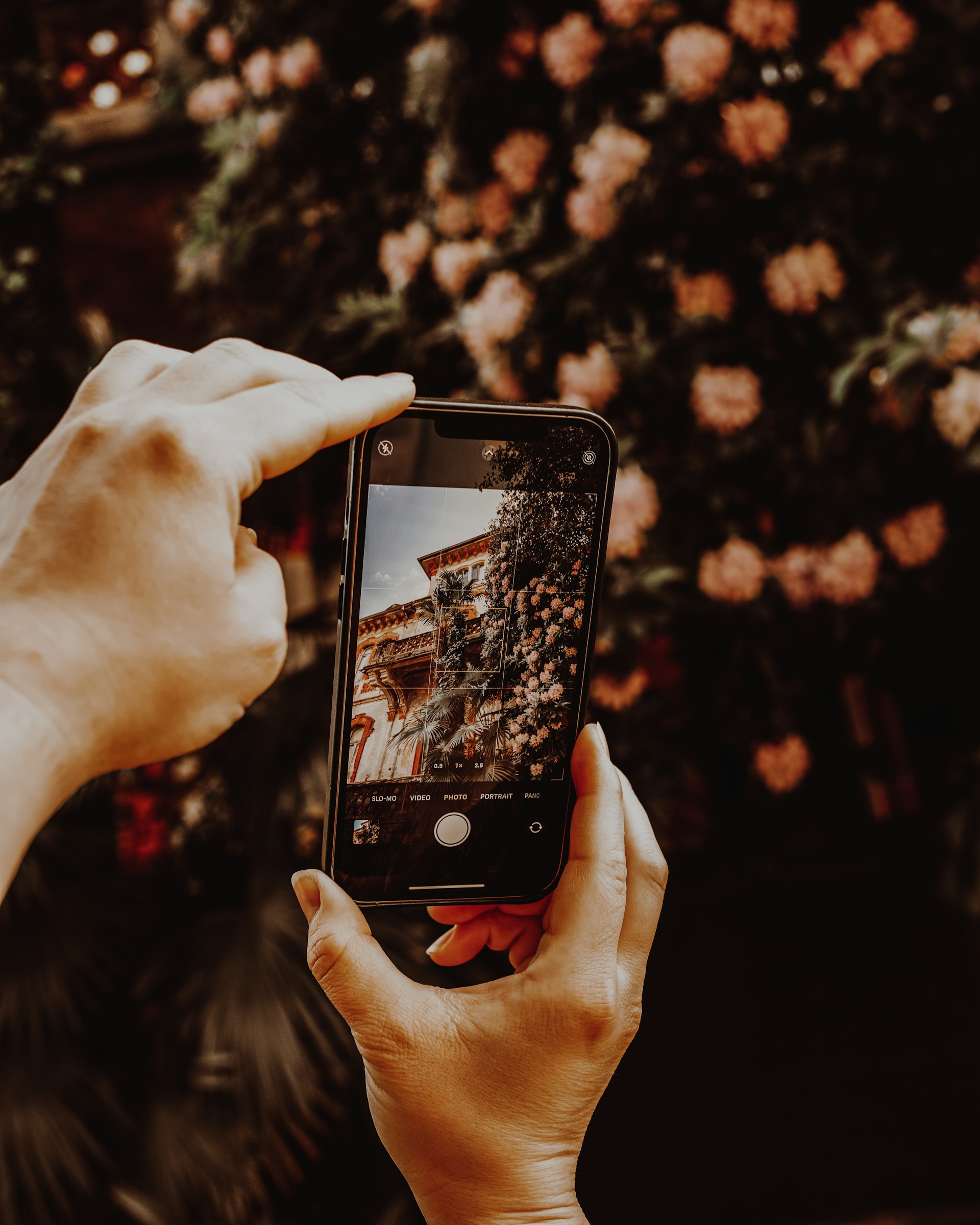 a person taking a picture with a cell phone