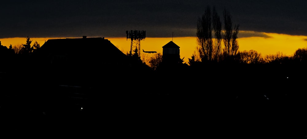 a dark picture of a building and a tower