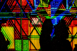 Abstract VJ mapping projection inspired by autumnal colors on a textured wall.