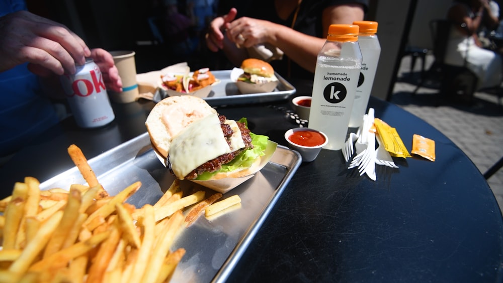 a tray with a sandwich and french fries on it