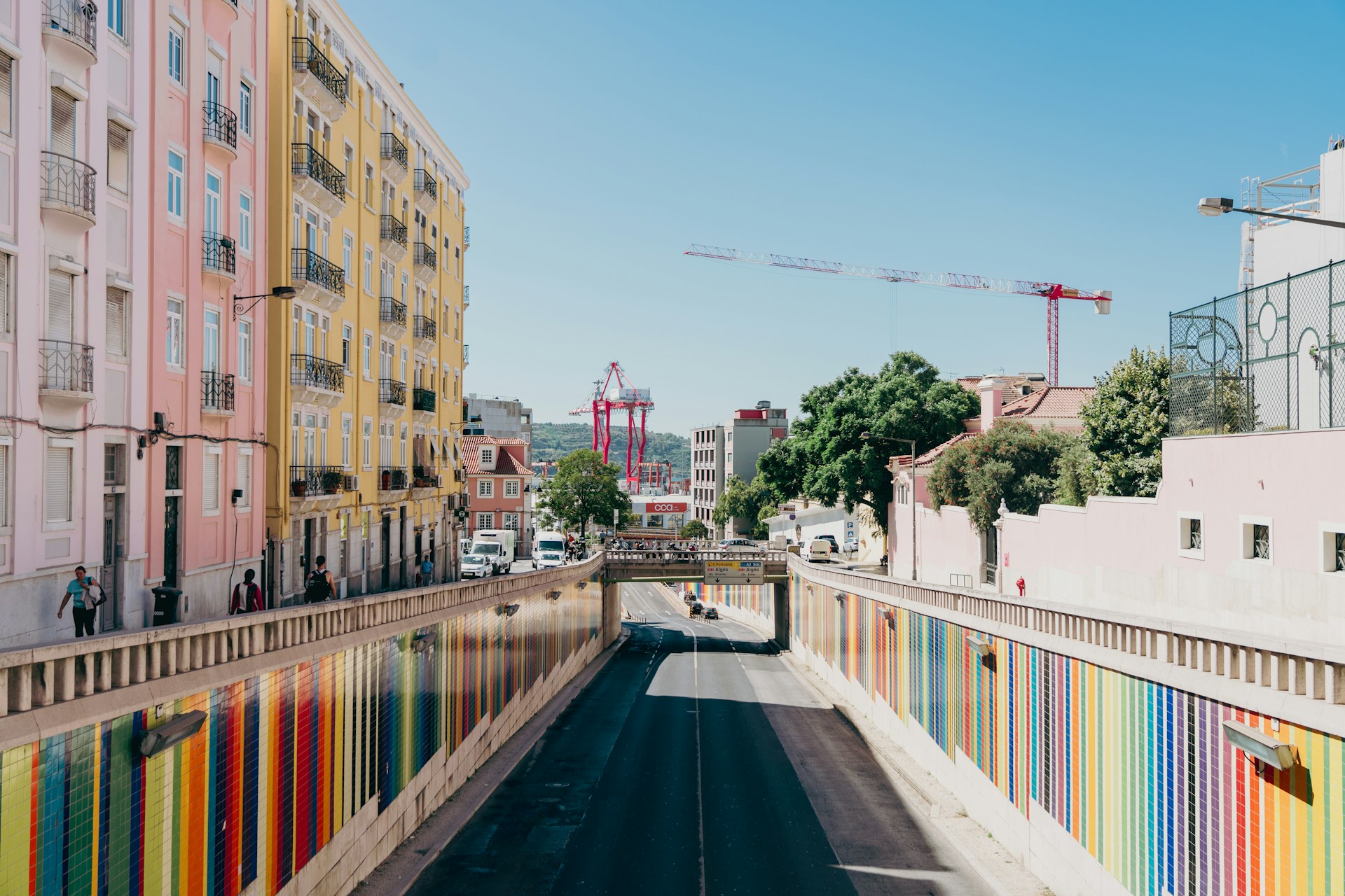 a city street lined with multicolored buildings